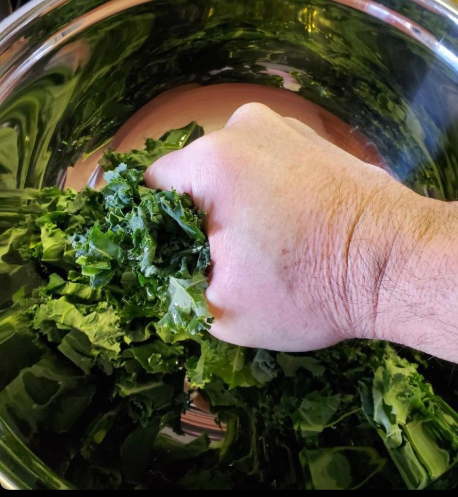 Man massaging kale