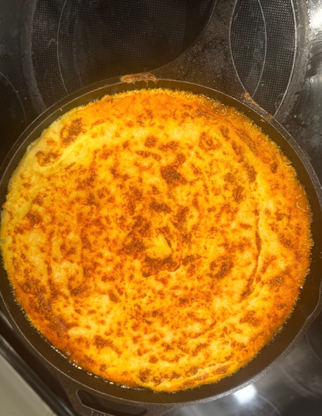 Cast iron skillet with a potato crusted vegan shepherd's pie.