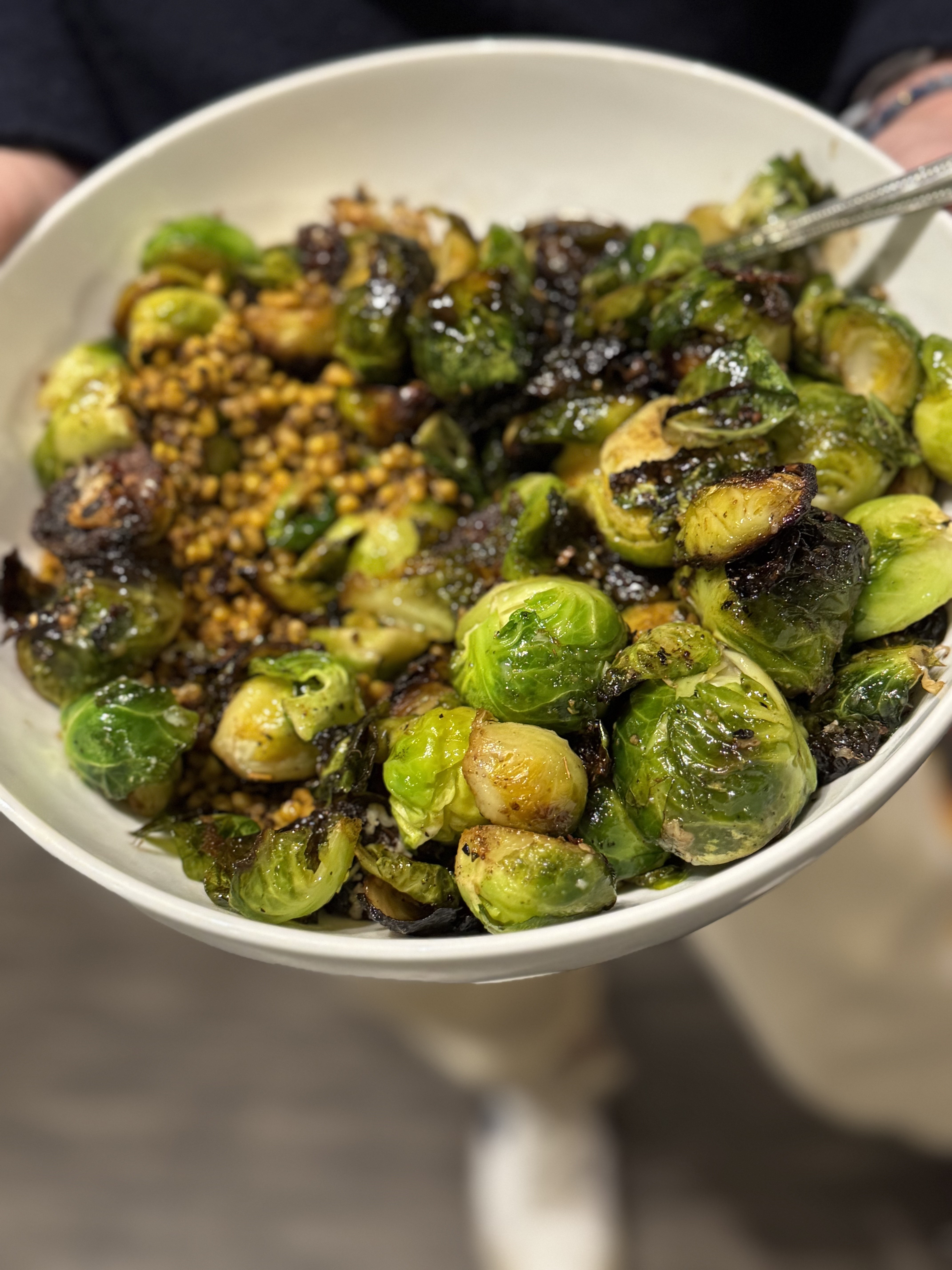 Bowl of charred brussels sprouts.